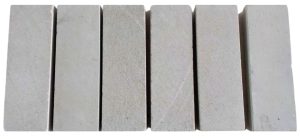 Original Java grey limestone tile samples on a clean white background